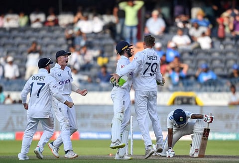 England's Tom Hartley (2nd right) celebrates with teammates after taking the wicket of India's Srikar Bharat during the fourth day of the first Test cricket match at the Rajiv Gandhi International Stadium in Hyderabad on Sunday.