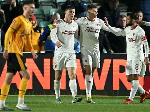 Manchester United's Danish striker #11 Rasmus Hojlund (2L) celebrates scoring the team's fourth goal during the English FA Cup fourth round football match between Newport County and Manchester United at Rodney Parade in Newport, south Wales on January 28, 2024. Manchester United won the match 4-2.