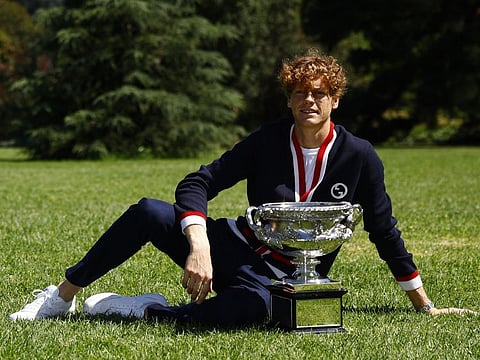 Italy's Jannik Sinner poses with the Australian Open trophy during a photo shoot at Royal Botanic Gardens Victoria, Melbourne, Australia on Monday.