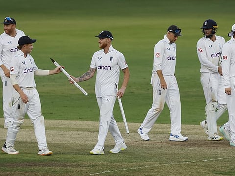 England's Ben Stokes celebrates with Ollie Pope and teammates after winning the first Test against India at Hyderabad.