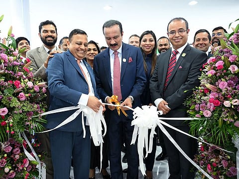 Alisha Moopen, Managing Director and Group CEO, Aster DM Healthcare GCC; Dr Azad Moopen, Founder and Chairman, Aster DM Healthcare; and N S Balasubramanian, CEO of Aster Retail, alongside leadership and staff from Aster DM Healthcare, inaugurating the Aster Booth at Arab Health 2024 on Monday in Dubai