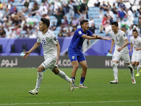 Uzbekistan's Abbosbek Fayzullayev celebrates scoring their second goal during a AFC Asian Cup Round of 16 match against Thailand at Al Janoub Stadium, Al Wakrah, Qatar on Tuesday.