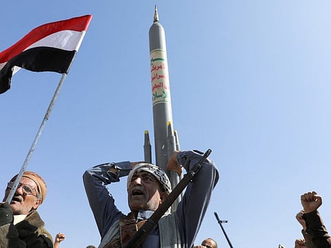 An Al Houthi militant carries a mock rocket during a parade in Sana'a on January 29, 2024 in solidarity with the Palestinians in the Gaza Strip and to show support to strikes on ships in the Red Sea and the Gulf of Aden.
