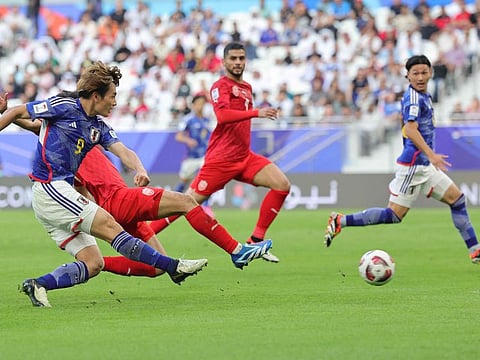 Japan's forward Ayase Ueda shoots to score his team's third goal during the Qatar 2023 AFC Asian Cup football match against Bahrain at Al Thumama Stadium in Doha on Wednesday.