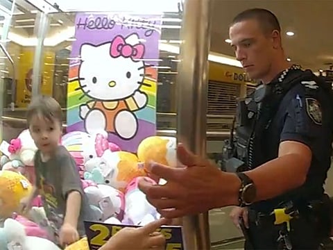 Three-year-old Ethan climbed into the machine via the prize dispenser chute.