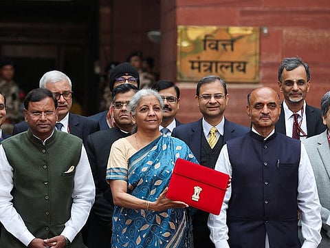 India's Finance Minister Nirmala Sitharaman holds up a folder with the Government of India's logo as she leaves her office to present the federal budget in the parliament, ahead of the nation's general election, in New Delhi, India, February 1, 2024