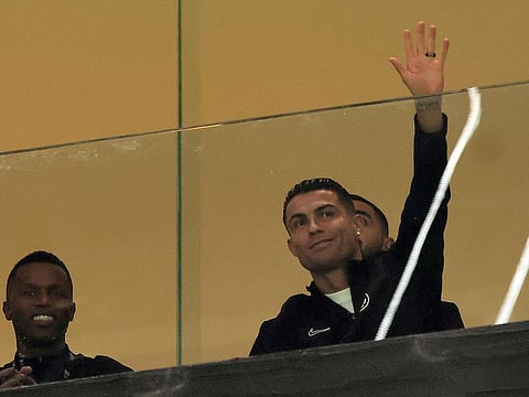 Nassr's injured Portuguese forward #07 Cristiano Ronaldo waves to spectators during the friendly football match between Saudi Arabia's al-Nassr FC and the US Inter Miami CF at the Kingdom Arena Stadium in Riyadh on February 1, 2024.