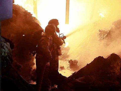 Firefighters put off a fire caused by an explosion at an industrial building in Nairobi, Kenya Friday, Feb. 2, 2024.