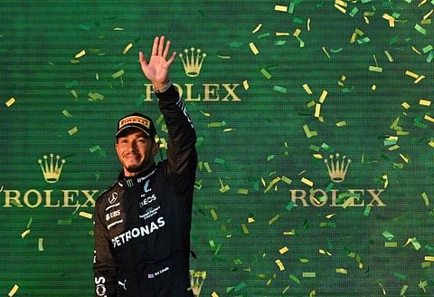 Lewis Hamilton celebrates on the podium after finishing second in 2023 F1 Australian Grand Prix.