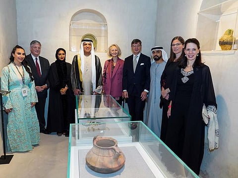 His Highness Sheikh Saud bin Saqr Al Qasimi (4th L), Supreme Council Member and Ruler of Ras Al Khaimah, with artists and dignitaries during a tour of the Festival on Friday night at Al Jazeera Al Hamra Heritage Village