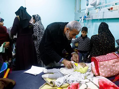 Palestinian doctor Said Abdul Rahman Marouf, who was detained by Israel for 45 days and released on February 1, examines patients at Abu Yousef Al Najjar Hospital in Rafah, in the southern Gaza Strip February 2, 2024.