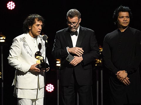 Zakir Hussain, Edgar Meyer and Rakesh Chaurasia accept the "Global Music Performance" award for "Pashto" on stage during the 66th Annual Grammy Awards pre-telecast show at the Crypto.com Arena in Los Angeles on February 4, 2024.