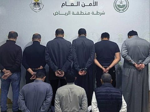 The offenders appear in a police photo after their arrest.