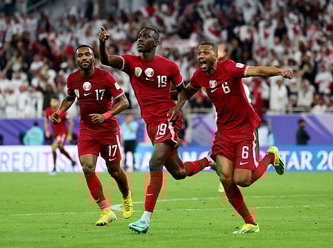 Qatar's Almoez Ali celebrates scoring their third goal with Abdulaziz Hatem during the AFC Asian Cup semi-final match against Iran at the Al Thumama Stadium, Doha, Qatar on Wednesday.