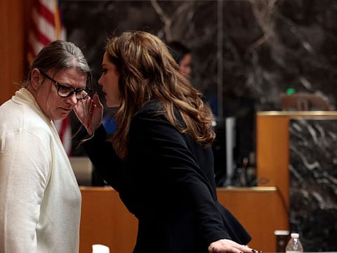 Jennifer Crumbley, the mother of accused Oxford High School gunman Ethan Crumbley, talks to attorney Shannon Smith in the courtroom of Oakland County Court in Pontiac, Michigan.