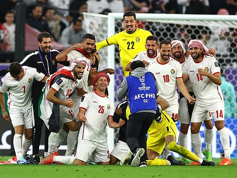 Jordan players celebrate after reaching the AFC Asian Cup final at the Ahmed Bin Ali Stadium, Al Rayyan, Qatar, on February 6.