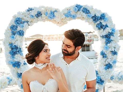 Indian national Pooja Motwani with Divyansh Kalwani on a super yacht at Dubai Harbour after he proposed to her.