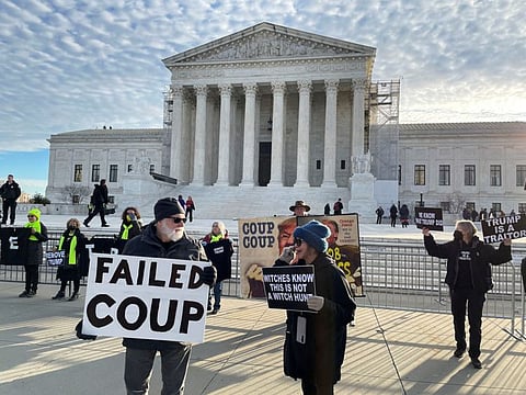 Demonstrators gather outside the US Supreme Court ahead of arguments in former US President Donald Trump's appeal of a lower court's ruling disqualifying him from the Colorado presidential primary ballot, in Washington, on February 8, 2024.