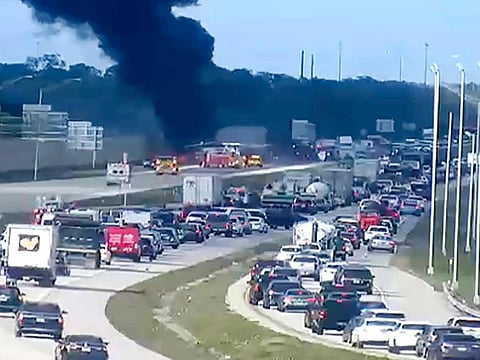 Florida Highway Patrol troopers are on the scene of a small airplane landing on southbound Interstate 75 in Naples, on February 9, 2024. The plane collided with a vehicle as it made the emergency landing.