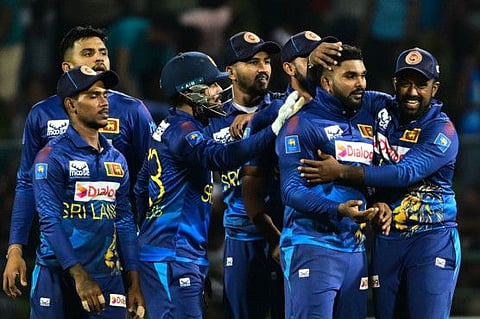 Sri Lanka's Wanindu Hasaranga (2nd Right) celebrates with teammates after taking the wicket of Afghanistan's Mohammad Nabi during the second ODI cricket match at the Pallekele International Cricket Stadium in Kandy on Sunday.