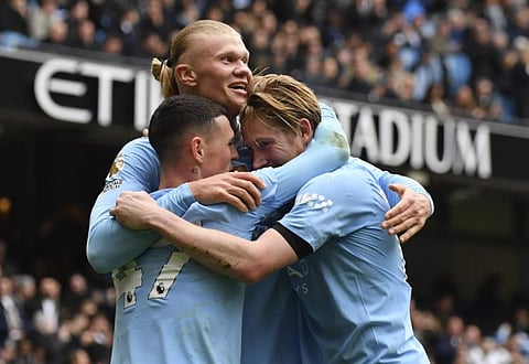 Manchester City's Erling Haaland celebrates with his teammates after scoring his side's second goal during the English Premier League soccer match against Everton, at the Etihad stadium in Manchester, England on February 10.