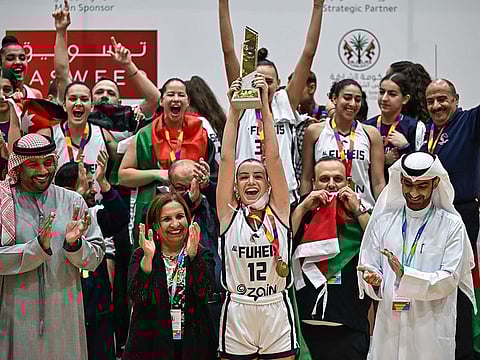 Reigning champions Al Fuheis of Jordan celebrate after retaining the basketball title in the seventh Arab Women Sports Tournament on Monday.