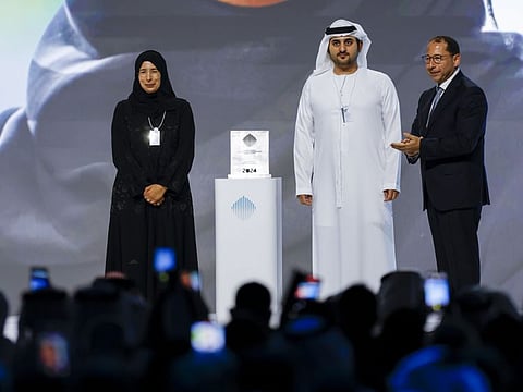 Sheikh Maktoum bin Mohammed bin Rashid Al Maktoum (centre) presents the Best Minister award to Dr Hanan Mohamed Al Kuwari (left), Minister of Public Health of Qatar, at the Summit at Madinat Jumeirah in Dubai on Monday