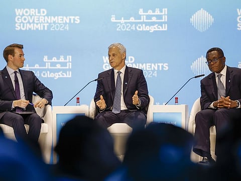 Bill Winters (centre), CEO of Standard Chatered Bank, gestures during a session "From Gold to Code: The Next Frontiers of Banking" at World Governments Summit at Madinat Jumeirah in Dubai. At right is Bernard Mensah, President of International Bank of America, with moderator Daniel Murphy (left), CNBC National Reporter. Photo taken on February 12, 2024.