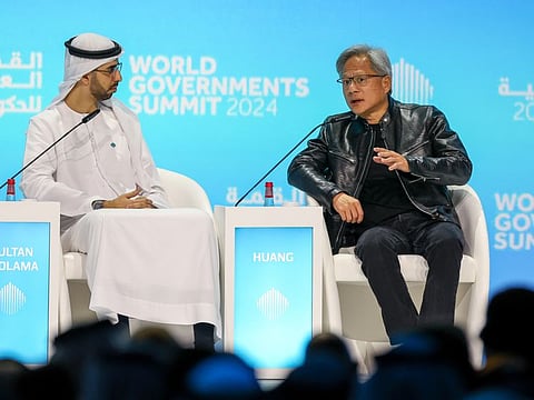 Omar Sultan Al Olama (L), Minister of State for Artificial Intelligence, Digital Economy and Remote Work Applications, and Jensen Huang, Founder and CEO, NVIDIA, during a session titled 'Who Will Shape the Future of AI?' at the World Government Summit in Dubai on Monday