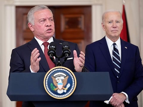Jordan's King Abdullah II speaks as President Joe Biden listens in the Cross Hall of the White House, on February 12, 2024, in Washington.
