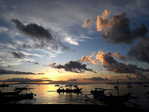 Tourist-dependent Bali attracts millions of foreign visitors annually.