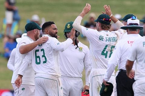 South Africas Dane Piedt (left) takes the wicket of New Zealands Neil Wagner during day two of the second cricket Test match at Seddon Park in Hamilton on Wednesday.