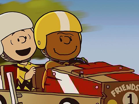 This image released by Apple TV+ shows Peanuts characters Charlie Brown, left, and Franklin in a scene from the animated special 'Snoopy Presents: Welcome Home, Franklin,' premiering Friday.