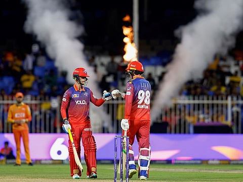 Dubai Capitals Tom Banton (right) congratulates Leus du Plooy during the Qualifier 2 at the Sharjah Cricket Stadium.
