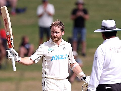 New Zealands Kane Williamson celebrates his century during day four of the second Test against South Africa in Hamilton on Friday.