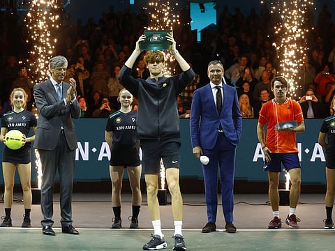 Italy's Jannik Sinner celebrates with the Rotterdam Open trophy after winning the final against Australia's Alex de Minaur on Sunday.