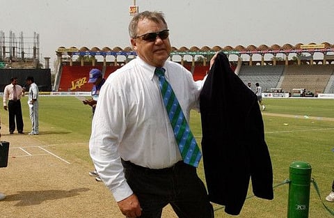 This picture taken on June 26, 2008 shows ICC match referee for the ongoing Asia Cup, Mike Procter walking back to the pavillion after the toss for the Group A match between Sri Lanka and UAE at the Gaddafi Stadium in Lahore.