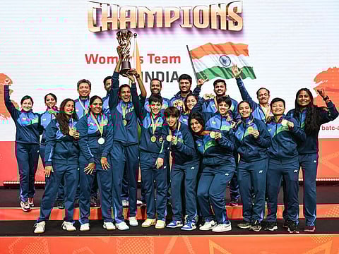 India's women players celebrate with the trophy after winning against Thailand at the 2024 Badminton Asia Team Championships in Shah Alam, Selangor, on Sunday.