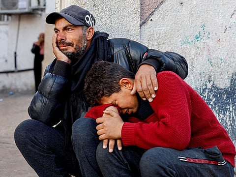 Mourners react as the bodies of Palestinians killed in Israeli strikes lie at Abu Yousef Al Najjar hospital in Rafah, in the southern Gaza Strip, on February 18, 2024.