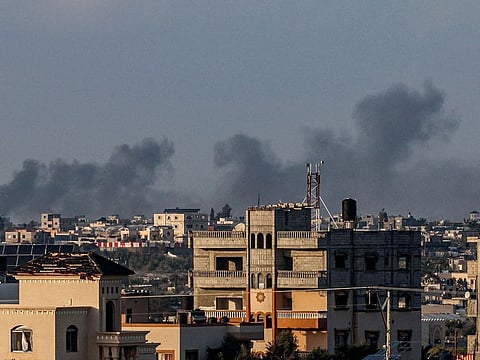 Smoke billowing over Khan Yunis in the southern Gaza Strip during Israeli bombardment amid continuing battles between Israel and the Palestinian militant group Hamas.