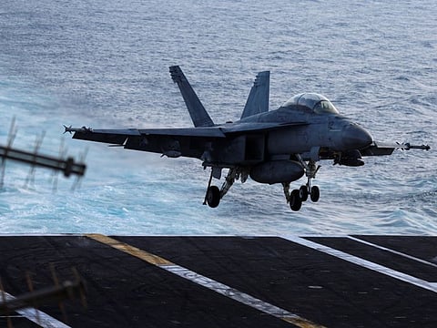 A F/A-18E Super Hornet fighter jet of the Fighting Swordsmen VFA-32 lands on the flight-deck of the USS Dwight D. Eisenhower (CVN 69) aircraft carrier in Southern Red Sea, Middle East, February 12, 2024.