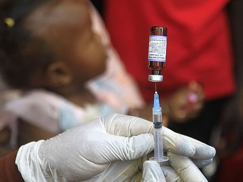 A Sudanese nurse prepares a vaccine shot in Sudan's Gedaref city during a vaccination campaign against the measles and rubella virus.