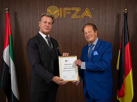 IFZA Chairman Martin G. Pedersen, left, receives a certificate of official partnership recognition from BVMW’s Hans-Josef Dollgen, Federal Senate for Economic Affairs