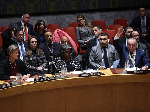 Algeria’s Ambassador to the United Nations Sofiane Mimouni votes in favor as US Ambassador to the United Nations Linda Thomas-Greenfield vetos a vote on a UN Security Council resolution to demand an immediate humanitarian ceasefire in Gaza, at UN headquarters in New York, on February 20, 2024.