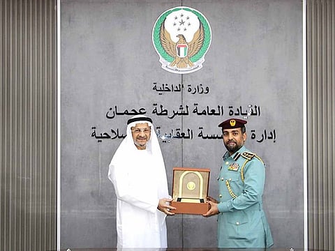 UAE businessman Firoz Merchant receiving facilitation shield from Colonel Mohammed Yusuf Al Matrooshi for his philanthropist work.
