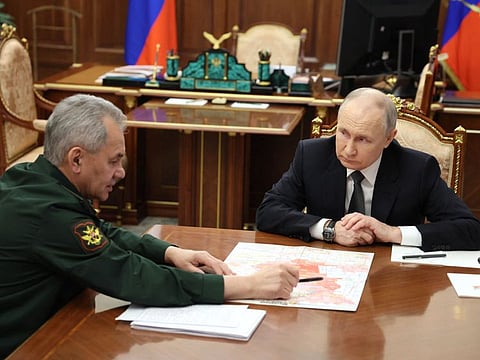 Russia's President Vladimir Putin meets with Defence Minister Sergei Shoigu at the Kremlin in Moscow on February 20, 2024.