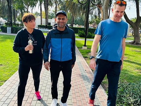 Dr Asad Sadiq (centre) encourages people to walk with others so they can talk their problems away