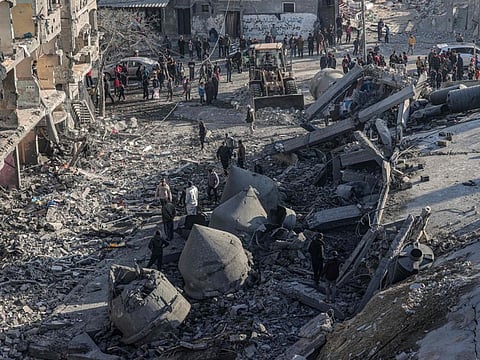 Palestinians check the rubble of the Al Farouq mosque on February 22, 2024, following an overnight Israeli air strike in Rafah refugee camp in the southern Gaza Strip.