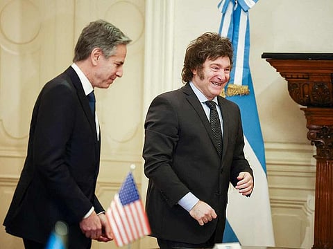 Argentina's President Javier Milei (right) walks with US Secretary of State Antony Blinken during a meeting at the Casa Rosada Presidential Palace, in Buenos Aires on February 23, 2024.