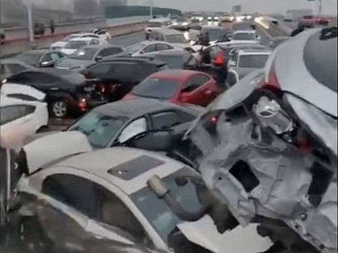 Cars pile up on an overpass during rainy and snowy weather, in Suzhou, Jiangsu, in this screengrab obtained from a video released on February 23, 2024
